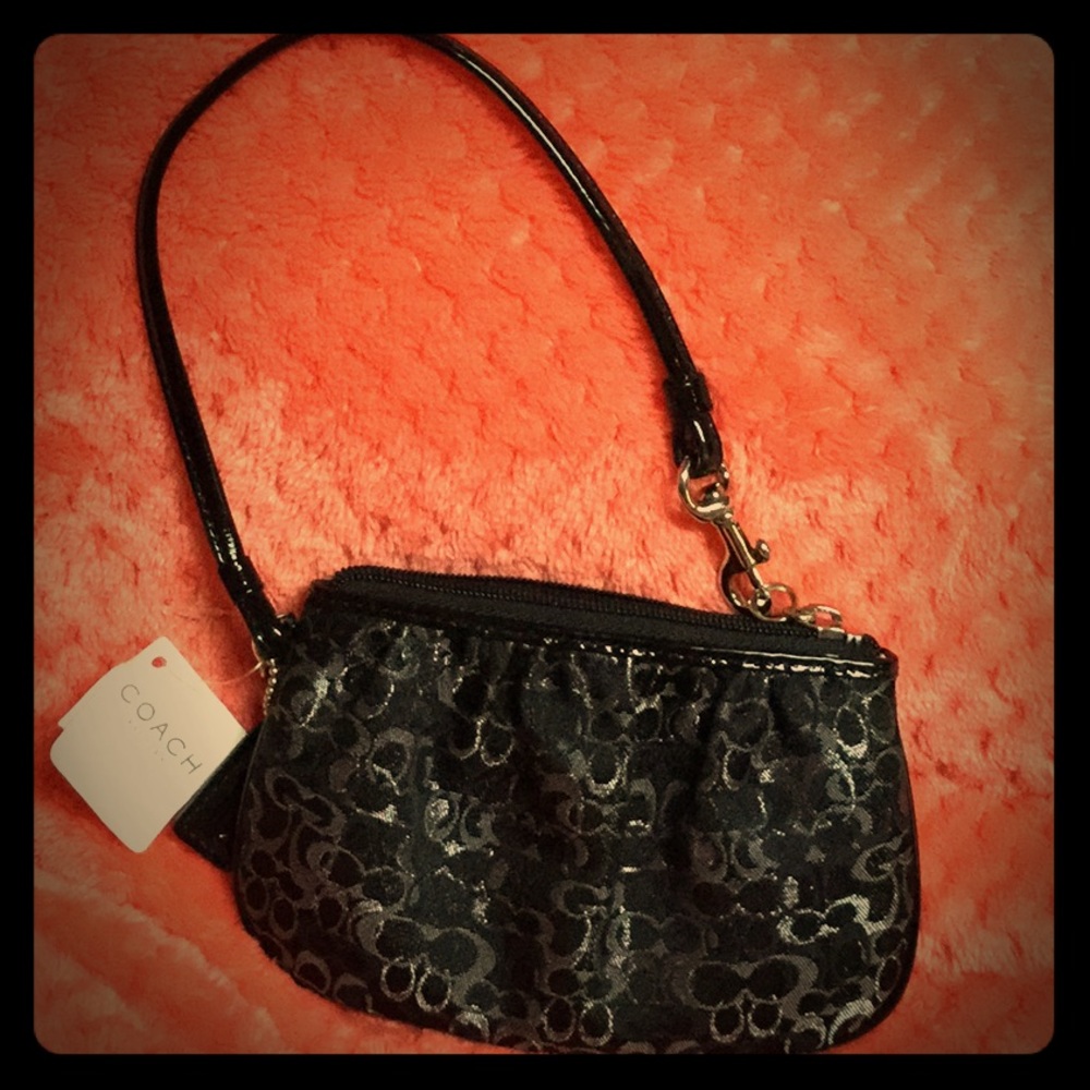 Silver and black Coach signature wristlet
